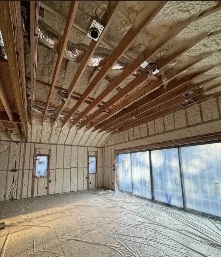 Interior walls and ceiling insulated with spray foam during new construction in East Rancho Dominguez